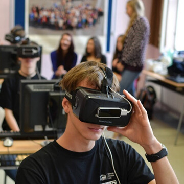 Student in an educational setting wearing virtual reality smart glasses